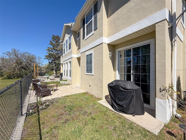 view of yard featuring a patio and a fenced backyard