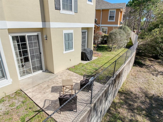 view of patio / terrace with fence