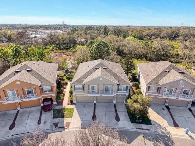 drone / aerial view featuring a view of trees