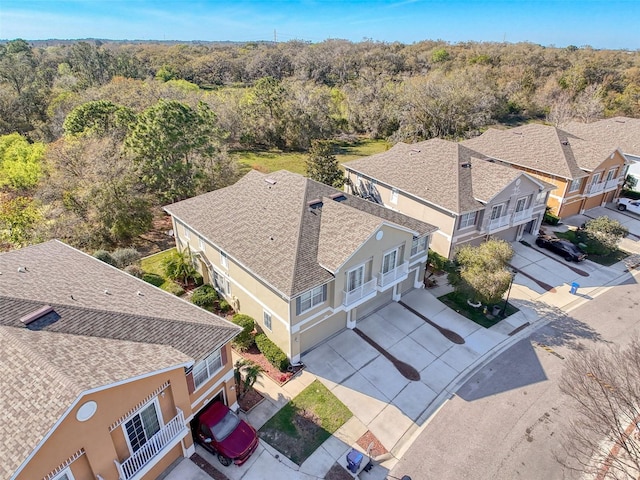 birds eye view of property with a forest view