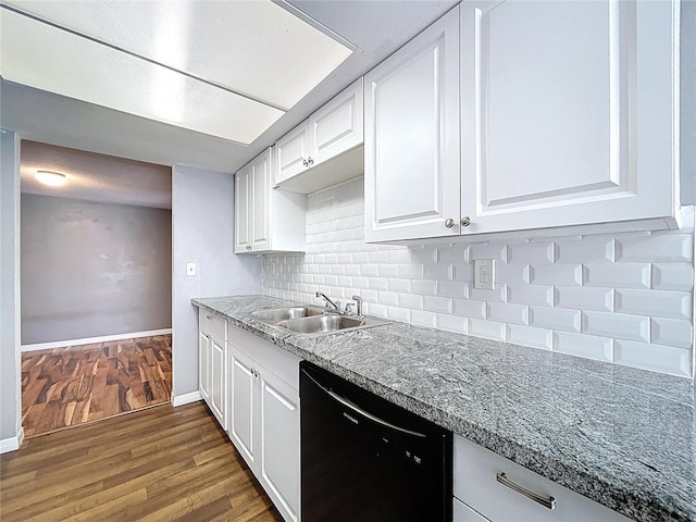 kitchen featuring a sink, decorative backsplash, dark wood-type flooring, black dishwasher, and white cabinetry