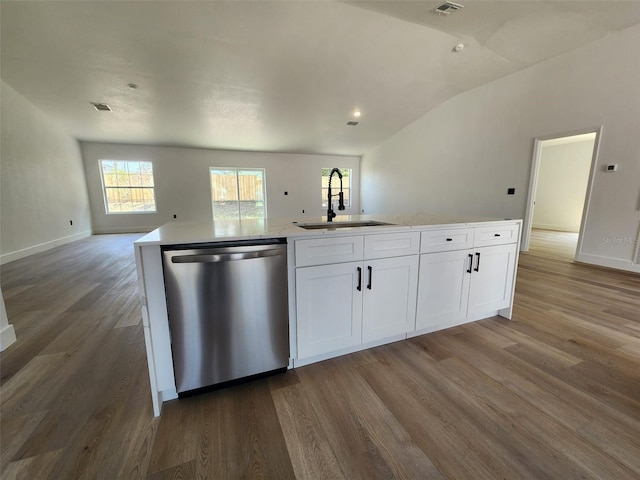1032 Concert Ave, Spring Hill, FL 34609 - kitchen featuring open floor plan, dishwasher, wood finished floors, white cabinetry, and a sink