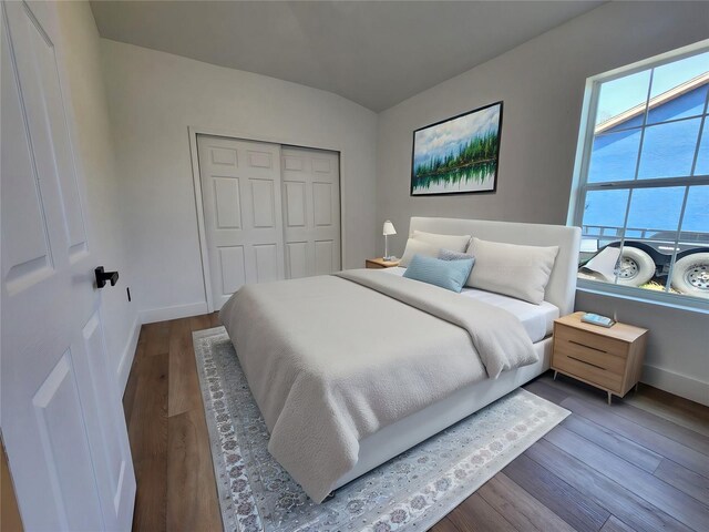 1032 Concert Ave, Spring Hill, FL 34609 - bedroom with a closet, baseboards, and wood finished floors