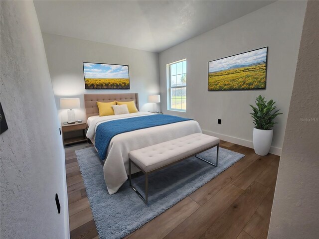 1032 Concert Ave, Spring Hill, FL 34609 - bedroom featuring baseboards and wood finished floors