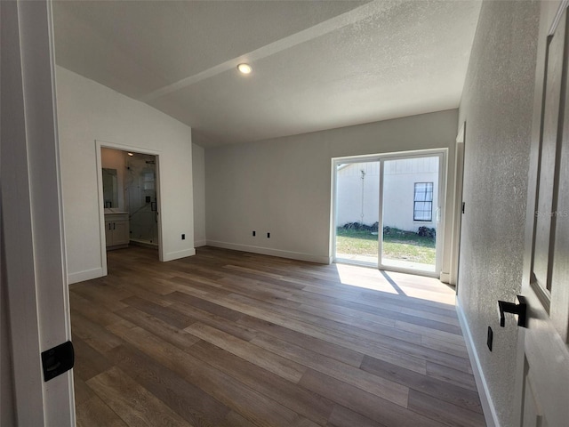 1032 Concert Ave, Spring Hill, FL 34609 - spare room featuring wood finished floors, baseboards, and a textured wall