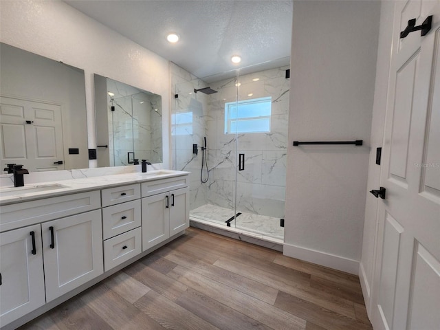 1032 Concert Ave, Spring Hill, FL 34609 - bathroom featuring a sink, wood finished floors, and double vanity