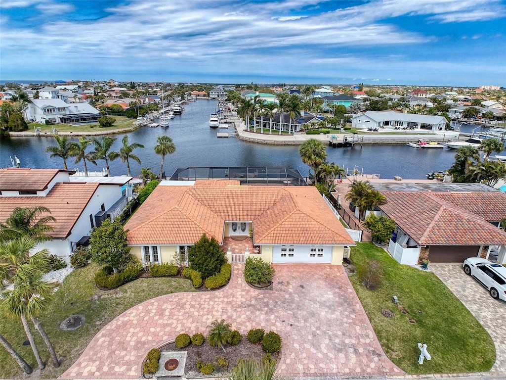 drone / aerial view with a residential view and a water view