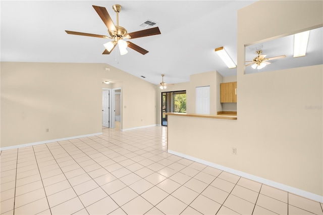 unfurnished living room with visible vents, baseboards, ceiling fan, light tile patterned floors, and vaulted ceiling with skylight