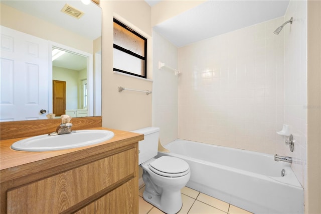 bathroom with visible vents, toilet,  shower combination, tile patterned flooring, and vanity