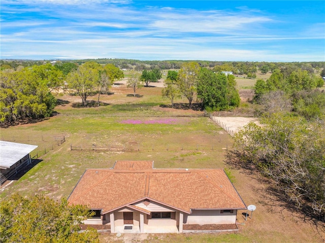 birds eye view of property with a rural view