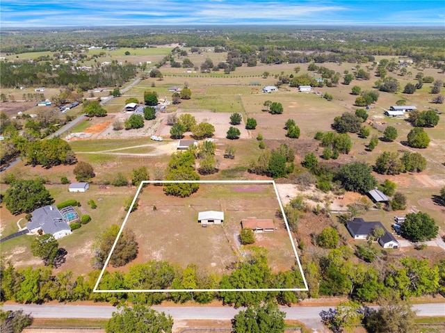 birds eye view of property featuring a rural view