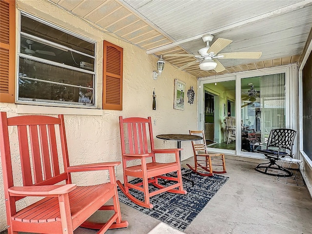 view of patio featuring ceiling fan