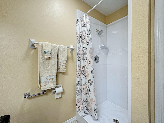 bathroom featuring a stall shower