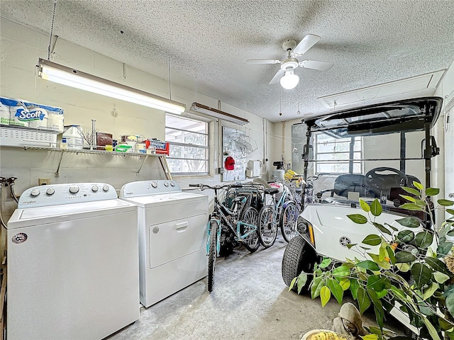 washroom featuring a healthy amount of sunlight, ceiling fan, laundry area, and washing machine and clothes dryer