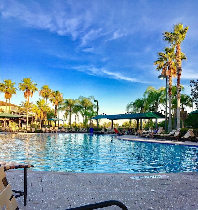 community pool featuring a patio area