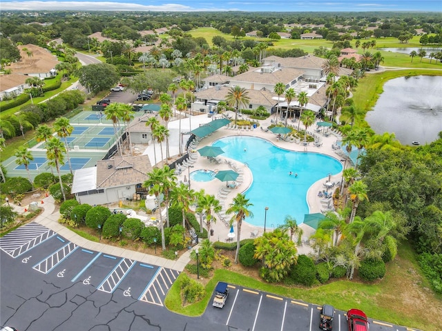 drone / aerial view featuring a water view and a residential view