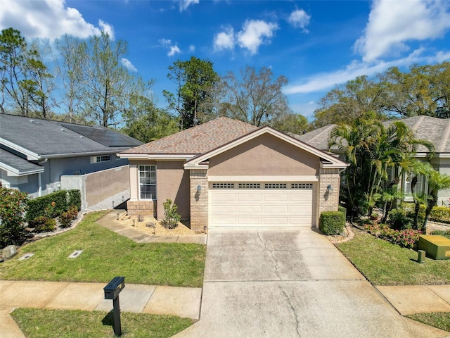 ranch-style home with stucco siding, a front lawn, driveway, a garage, and brick siding