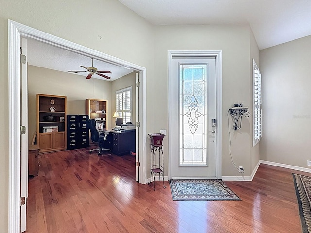 foyer with baseboards, ceiling fan, and hardwood / wood-style flooring