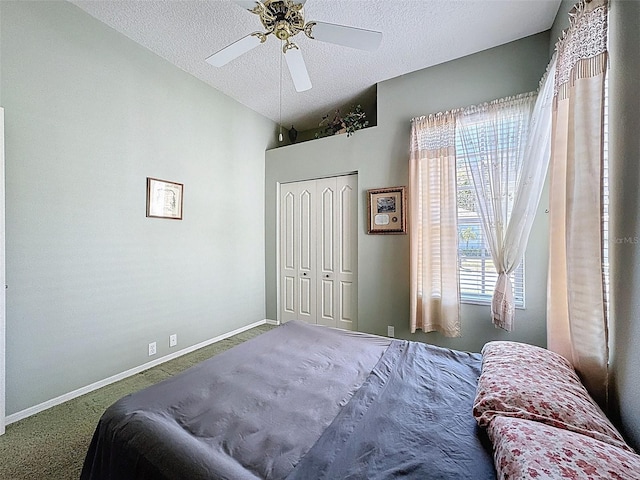 bedroom with baseboards, a textured ceiling, lofted ceiling, and carpet floors