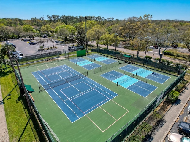 view of tennis court with fence