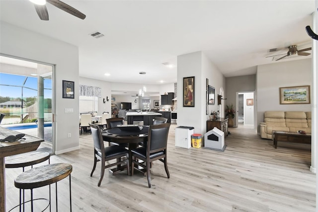 dining area featuring baseboards, visible vents, light wood-style flooring, recessed lighting, and ceiling fan