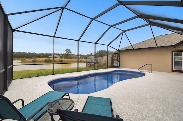 pool featuring a lanai, a patio, and fence