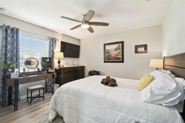 bedroom featuring ceiling fan and light wood-style flooring