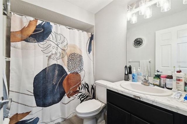 bathroom with vanity, toilet, and a shower with curtain