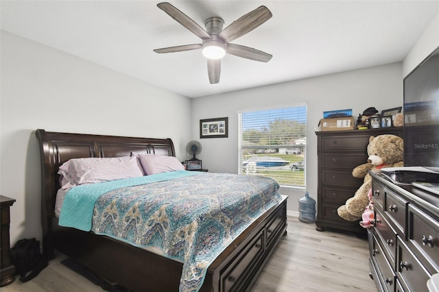 bedroom featuring a ceiling fan and light wood finished floors