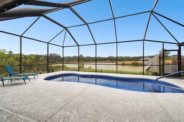 outdoor pool featuring a lanai and a patio area