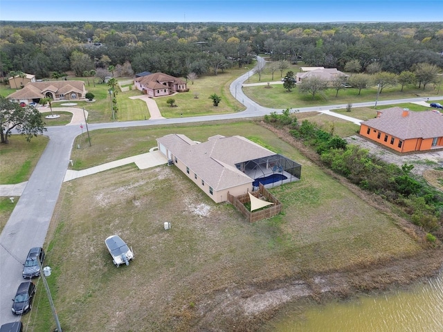 bird's eye view featuring a wooded view