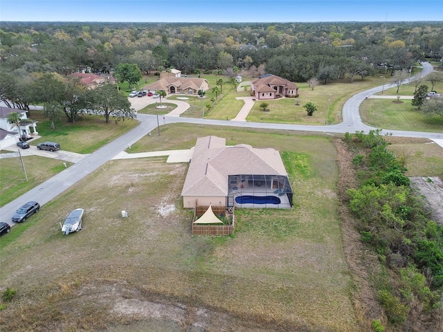 drone / aerial view with a view of trees