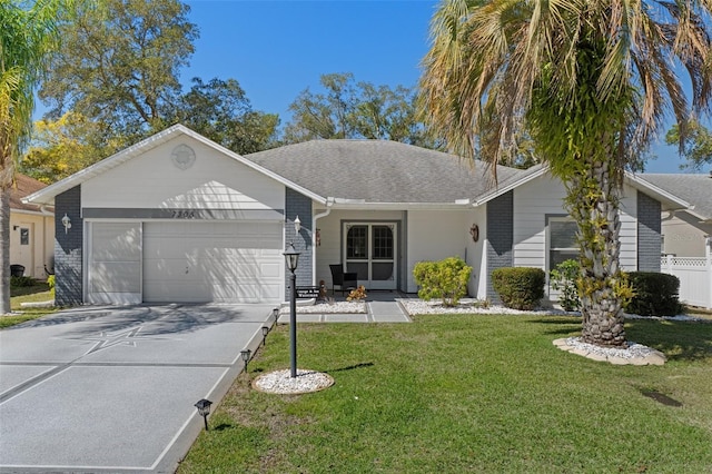 single story home featuring brick siding, concrete driveway, a front yard, roof with shingles, and a garage