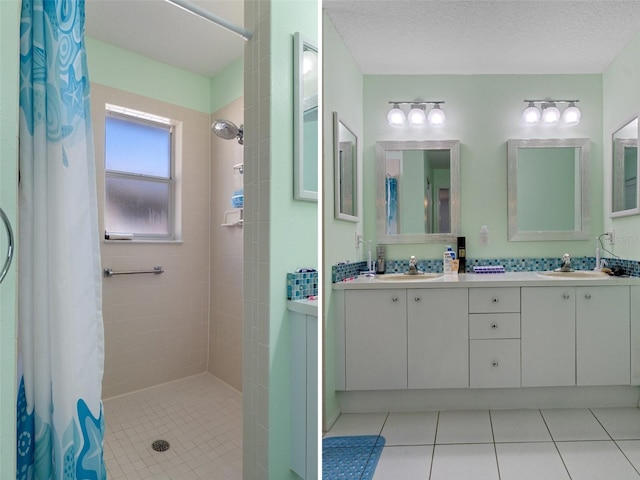 bathroom featuring a sink, tiled shower, double vanity, and tile patterned flooring