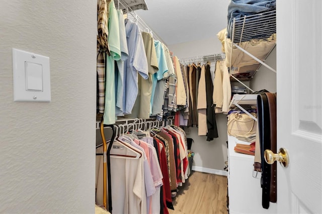 spacious closet with wood finished floors