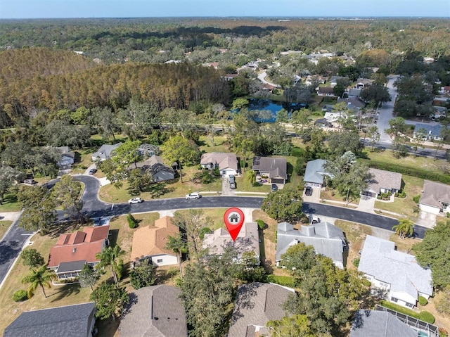 aerial view featuring a residential view and a view of trees