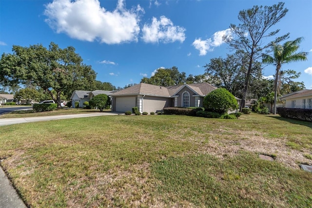 ranch-style house with a front lawn, concrete driveway, and a garage