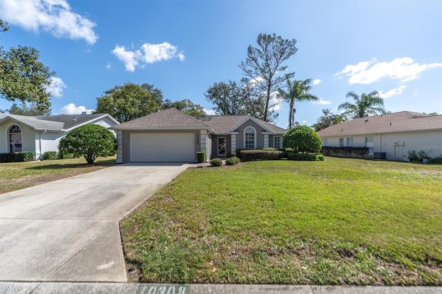 single story home with a garage, concrete driveway, and a front yard