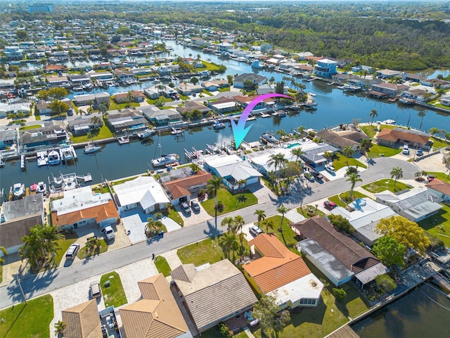 aerial view with a residential view and a water view