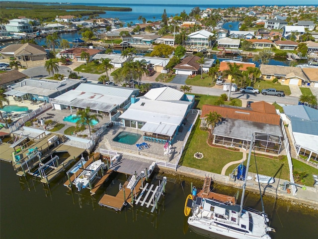 aerial view with a residential view and a water view