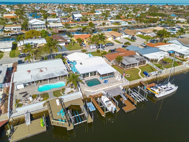 bird's eye view with a residential view and a water view