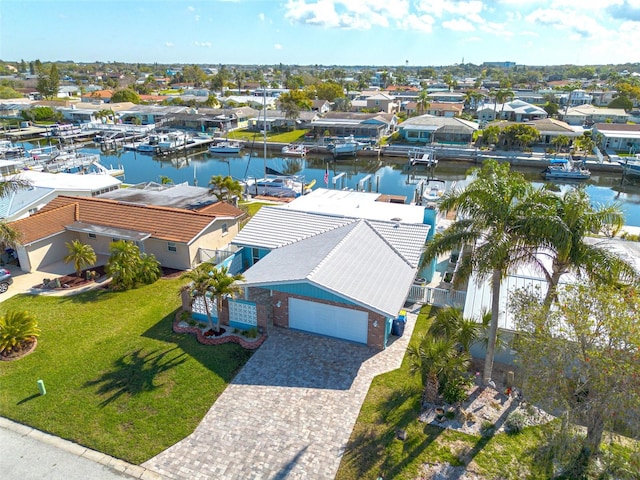 aerial view featuring a residential view and a water view