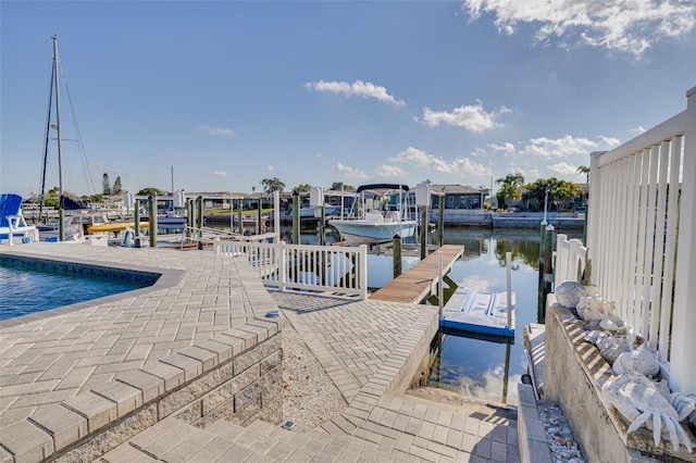 view of dock with a water view and boat lift