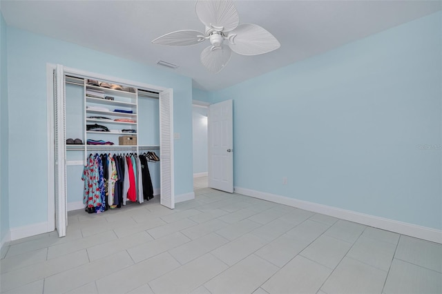 unfurnished bedroom featuring a closet, visible vents, baseboards, and ceiling fan