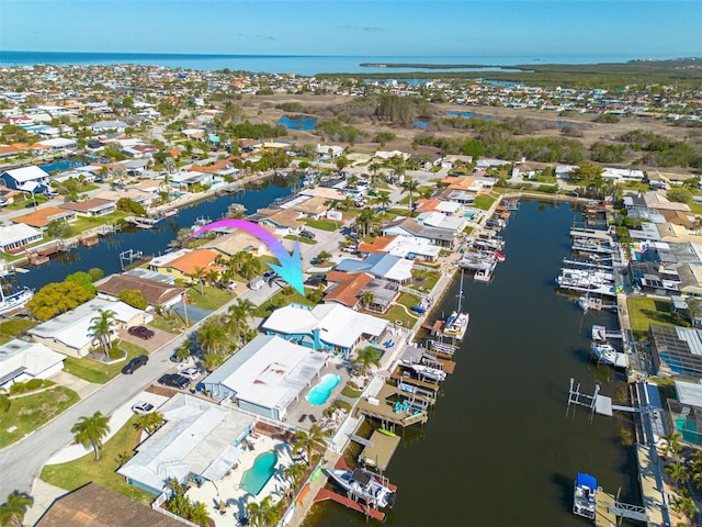 bird's eye view with a residential view and a water view