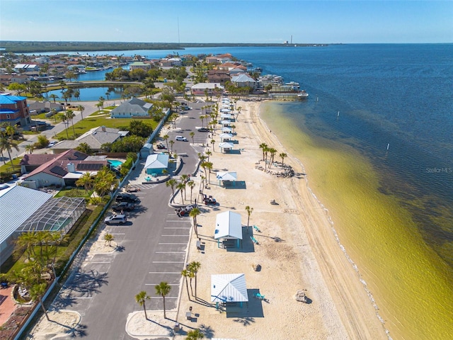 aerial view featuring a view of the beach and a water view