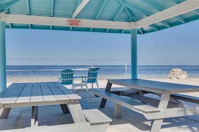 view of patio with a water view