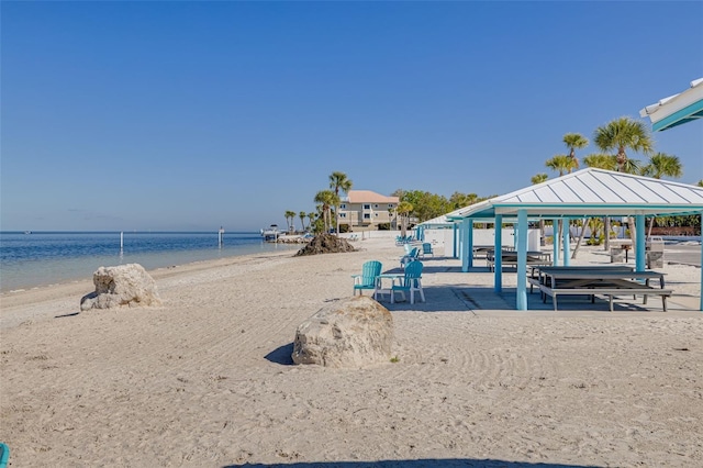 water view with a gazebo and a beach view