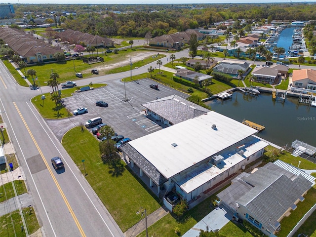 birds eye view of property featuring a water view and a residential view