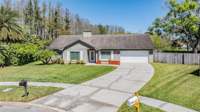 single story home with a front yard, concrete driveway, an attached garage, and fence